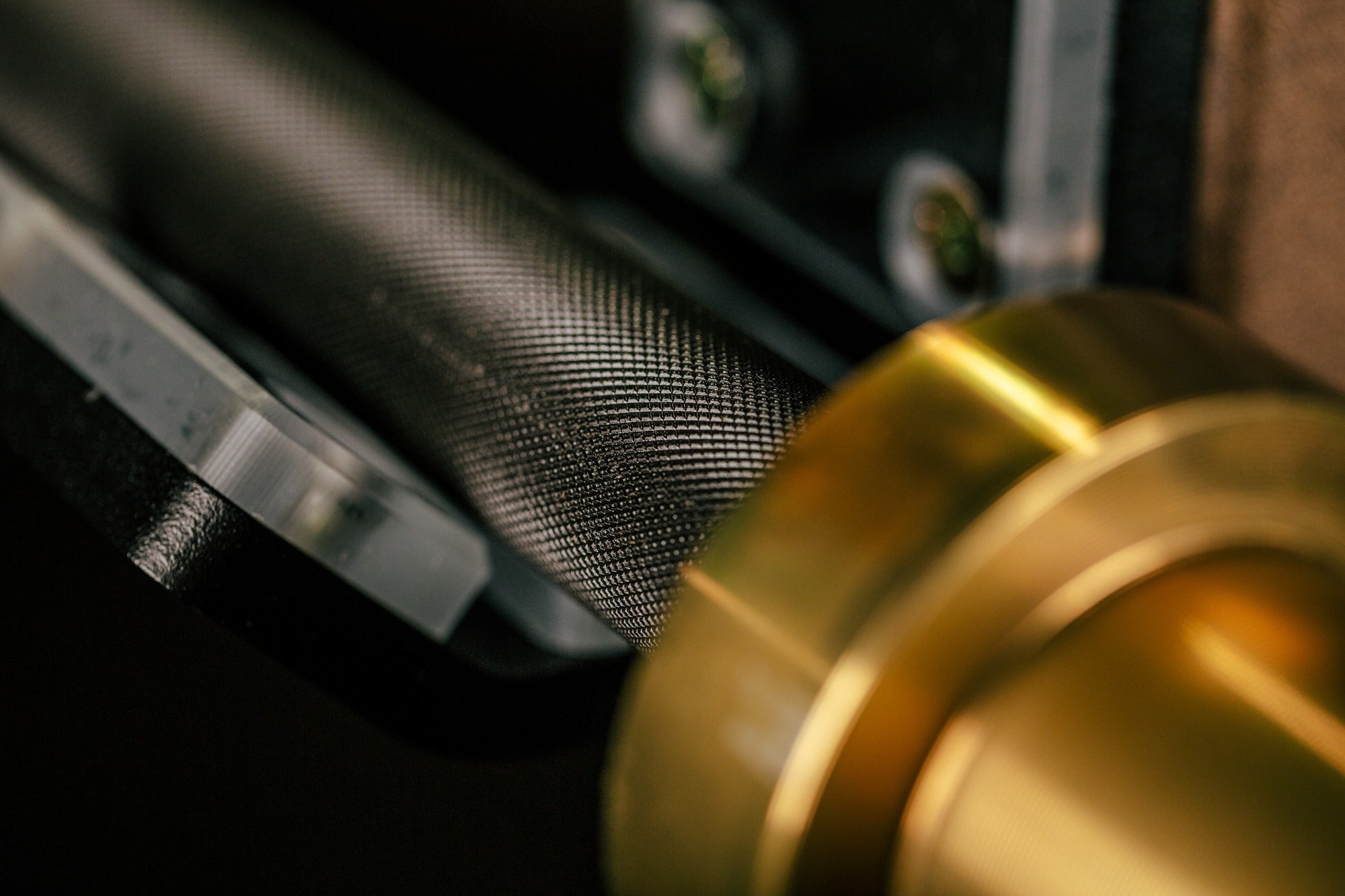 close up of texture on the shaft on workhorse barbell