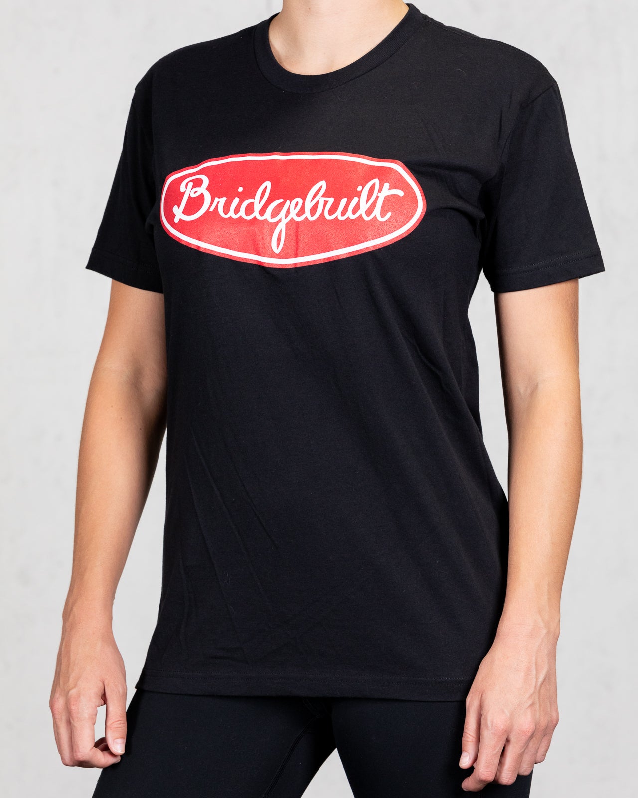 woman wearing black trucker tee