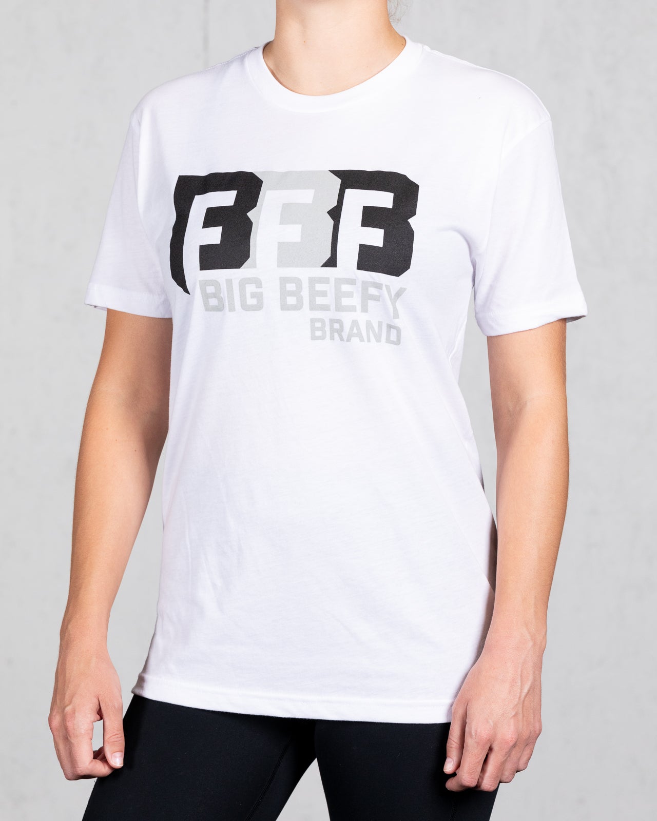 woman wearing white big beefy brand tee