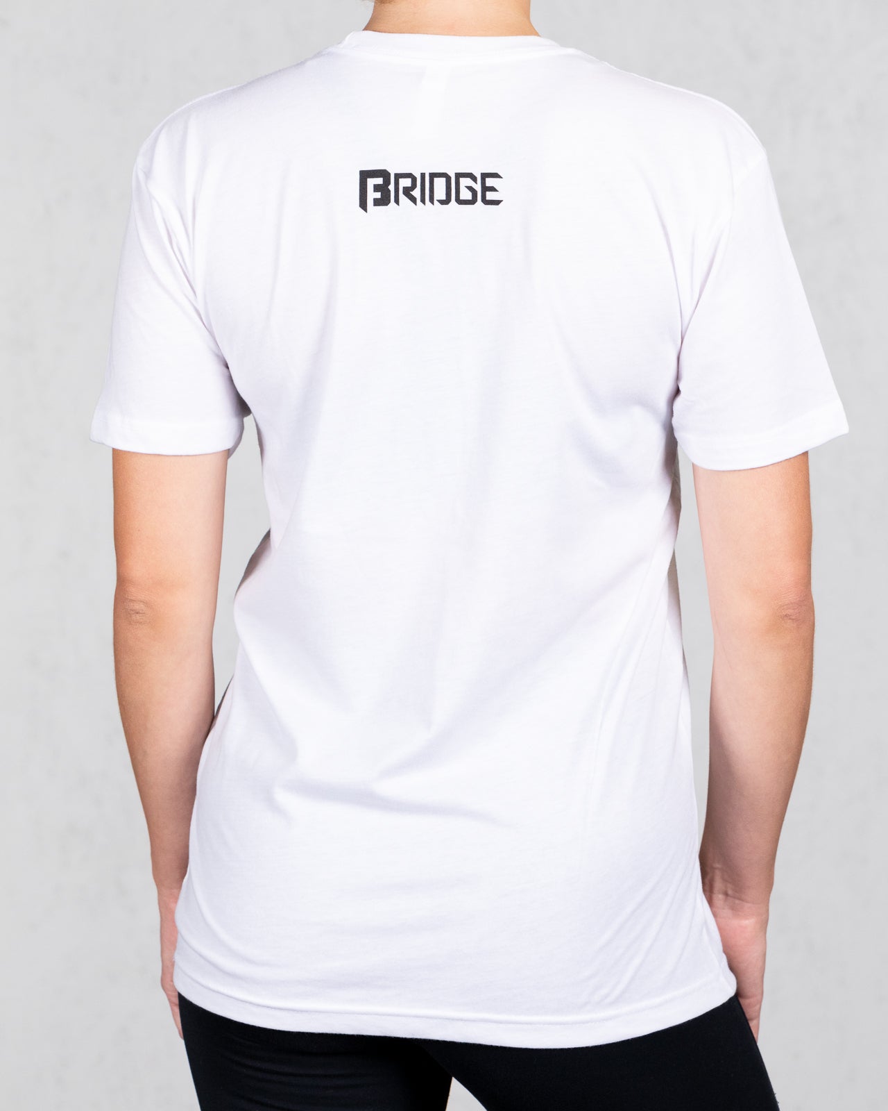 woman wearing white big beefy brand tee from back