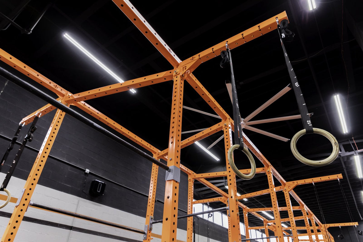 Overhead view of an orange BUILT rig with gymnastics rings