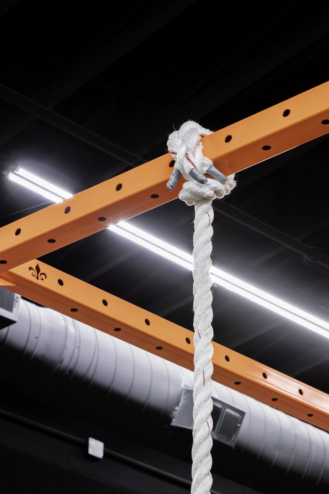 Climbing rope hung from an orange BUILT rig crossmember