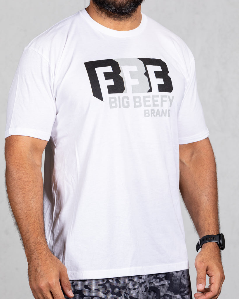man wearing white big beefy brand shirt